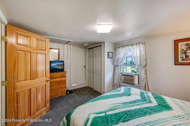 bedroom with dark carpet, a closet, and cooling unit