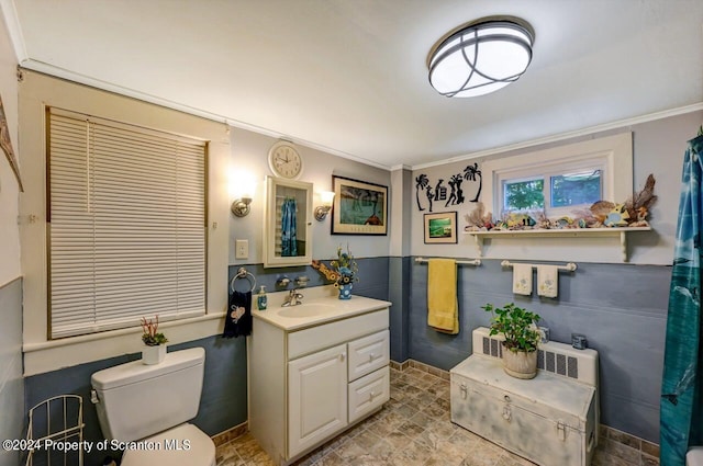 bathroom featuring crown molding, vanity, and toilet