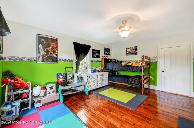 bedroom featuring wood-type flooring and ceiling fan