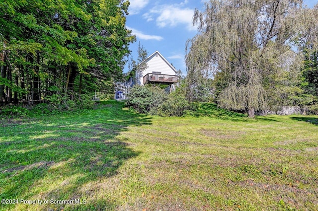 view of yard featuring a deck