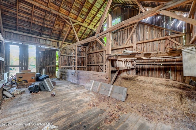 miscellaneous room featuring high vaulted ceiling and a healthy amount of sunlight