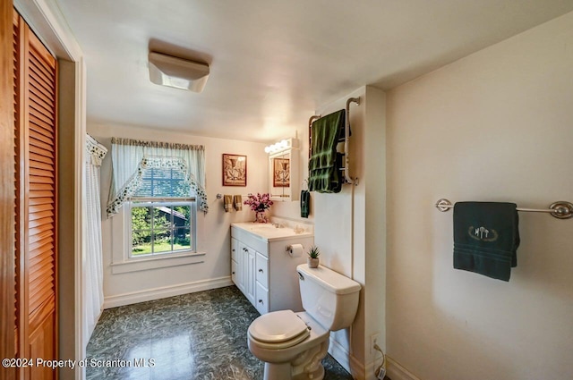 bathroom with vanity and toilet