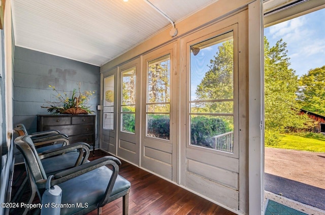 doorway to outside with dark hardwood / wood-style floors