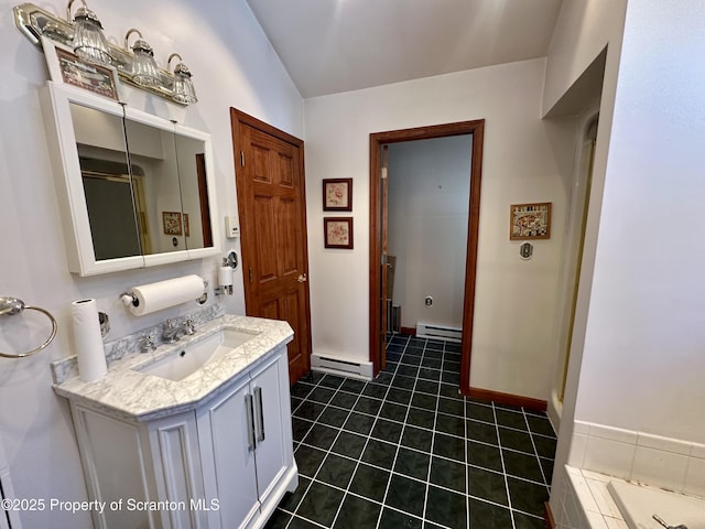 bathroom with vanity, lofted ceiling, a baseboard heating unit, and tile patterned floors