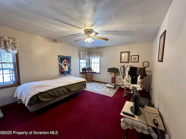 bedroom with ceiling fan and carpet flooring