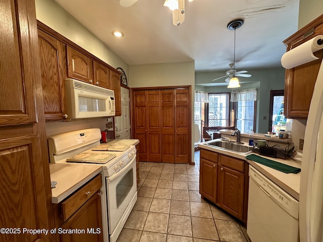 kitchen with ceiling fan, white appliances, and sink