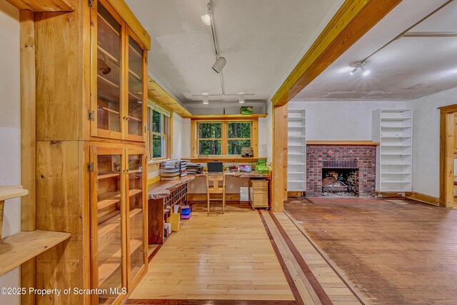 837 Old State Rd, Waverly Twp, PA 18411 - interior space with track lighting, light wood finished floors, and a fireplace