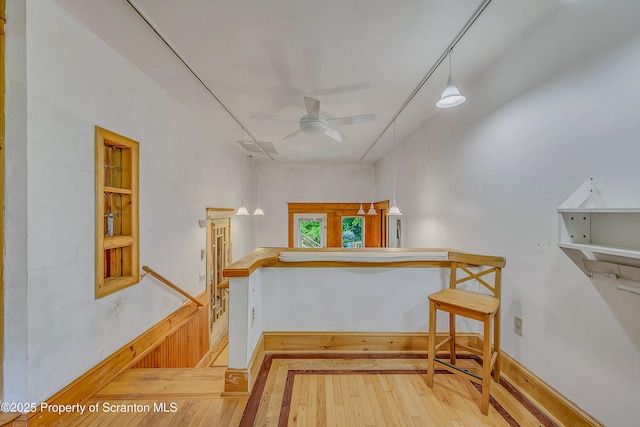 837 Old State Rd, Waverly Twp, PA 18411 - stairs featuring wood-type flooring, ceiling fan, and baseboards