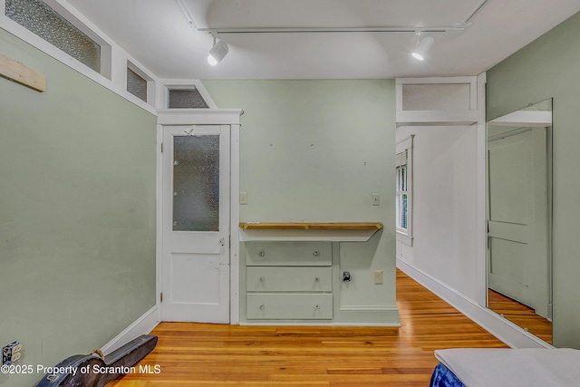 837 Old State Rd, Waverly Twp, PA 18411 - kitchen featuring rail lighting, wood finished floors, and baseboards