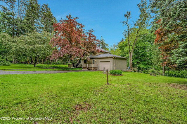 837 Old State Rd, Waverly Twp, PA 18411 - view of front facade featuring driveway, a front lawn, and an attached garage