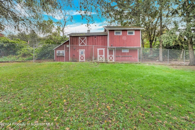 view of outbuilding featuring a yard