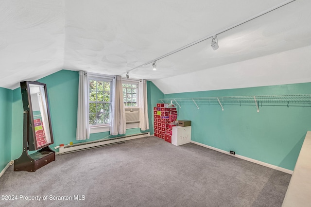 additional living space with lofted ceiling, carpet floors, and a baseboard heating unit