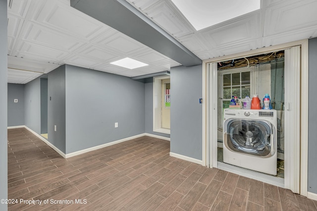 clothes washing area featuring washer / dryer and hardwood / wood-style flooring