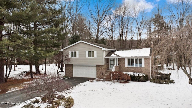 split level home with a garage