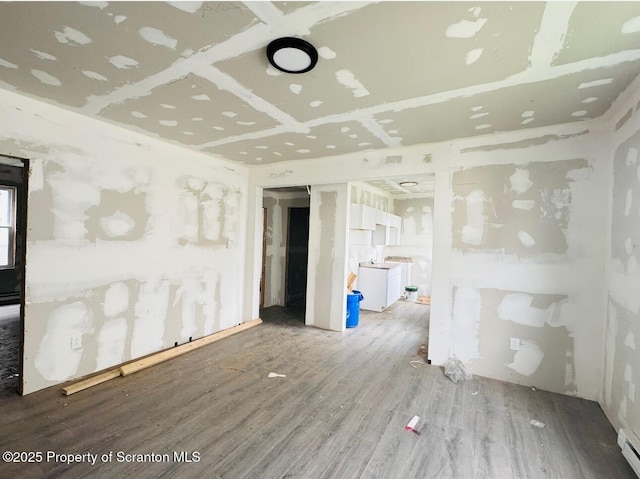 1537 Gardner Ave, Scranton, PA 18509 - unfurnished room with wood finished floors, a baseboard heating unit, and washer / clothes dryer