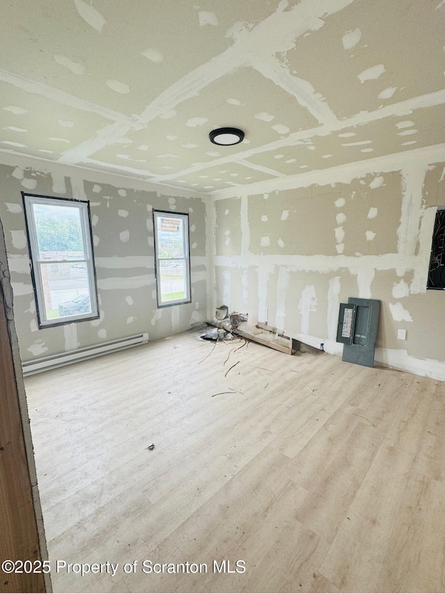 1537 Gardner Ave, Scranton, PA 18509 - unfurnished living room featuring a baseboard radiator and wood finished floors