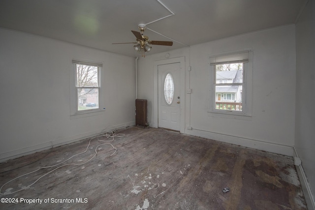 entrance foyer with ceiling fan and a healthy amount of sunlight