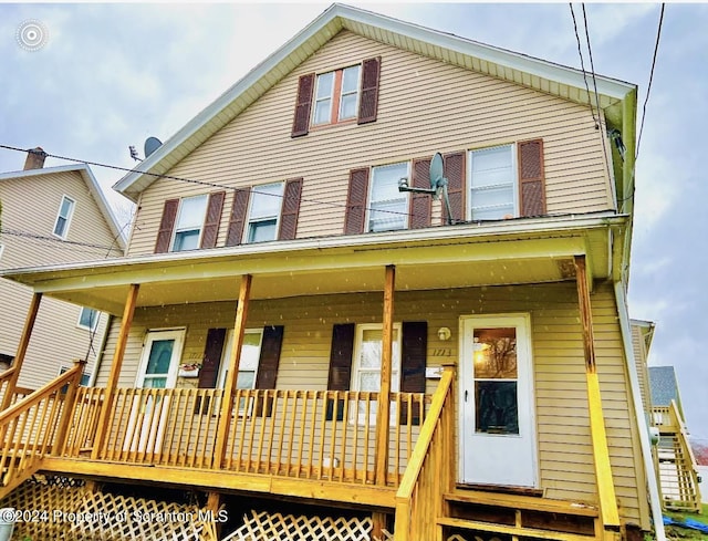 rear view of house with a porch