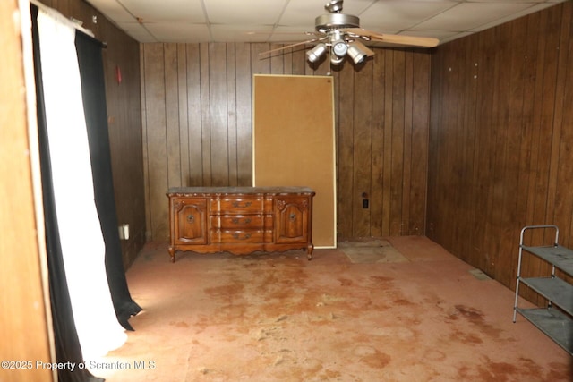 74 Matthews Rd, Spring Brook Twp, PA 18444 - unfurnished dining area with wood walls, a ceiling fan, and a paneled ceiling