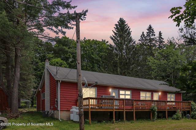 74 Matthews Rd, Spring Brook Twp, PA 18444 - back of property featuring a deck and a chimney
