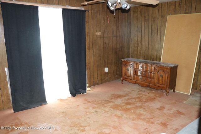74 Matthews Rd, Spring Brook Twp, PA 18444 - carpeted empty room featuring wood walls and ceiling fan