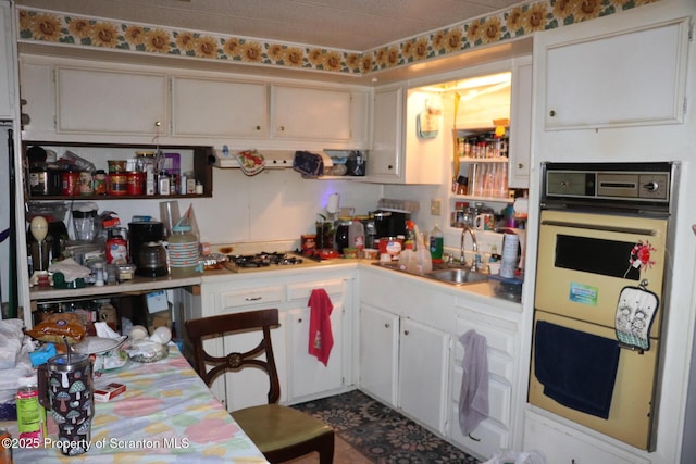 74 Matthews Rd, Spring Brook Twp, PA 18444 - kitchen with multiple ovens, gas cooktop, light countertops, and white cabinets
