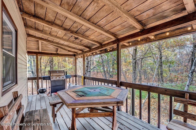 wooden terrace featuring grilling area