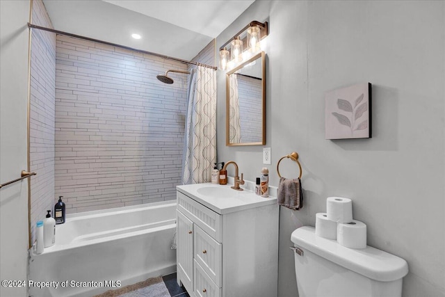 full bathroom featuring vanity, shower / bath combination with curtain, and toilet