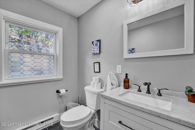 bathroom featuring vanity, a baseboard radiator, and toilet