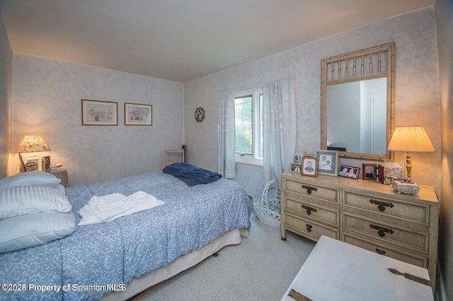 bedroom featuring carpet flooring and wallpapered walls