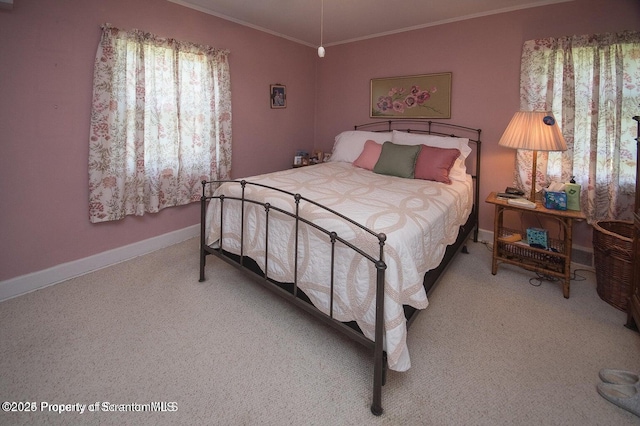 bedroom featuring carpet flooring, baseboards, and ornamental molding