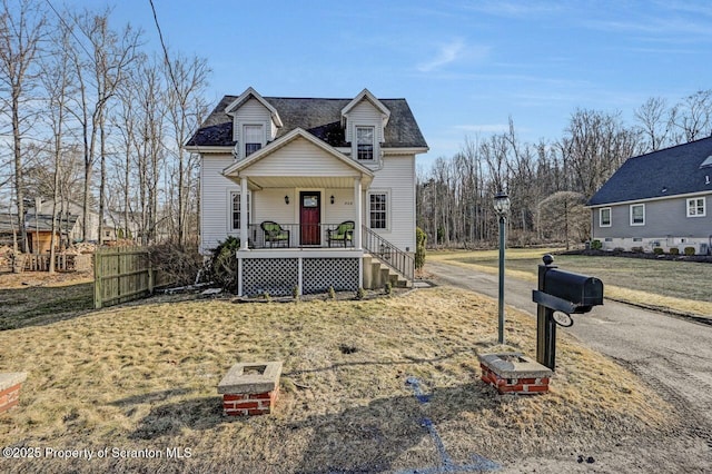 view of front of house with covered porch and aphalt driveway