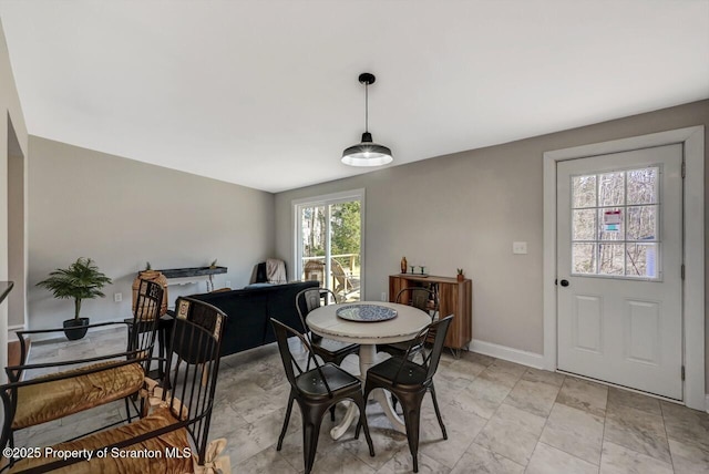 dining room featuring baseboards