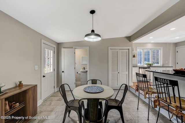 dining area featuring plenty of natural light and recessed lighting