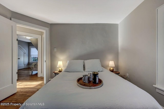 bedroom featuring wood finished floors