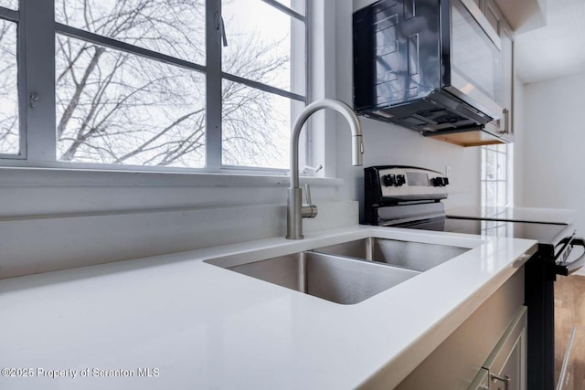 kitchen with sink and stainless steel electric range