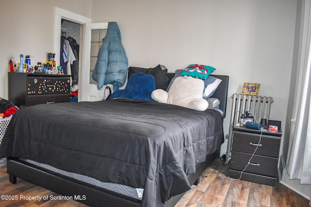 bedroom featuring wood finished floors
