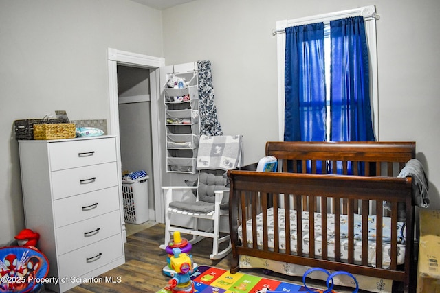 640 Alder St, Scranton, PA 18505 - bedroom with wood finished floors and a crib