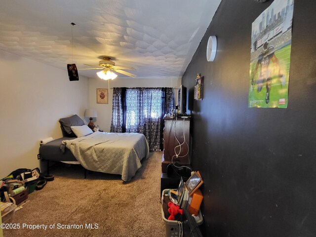 carpeted bedroom featuring a ceiling fan