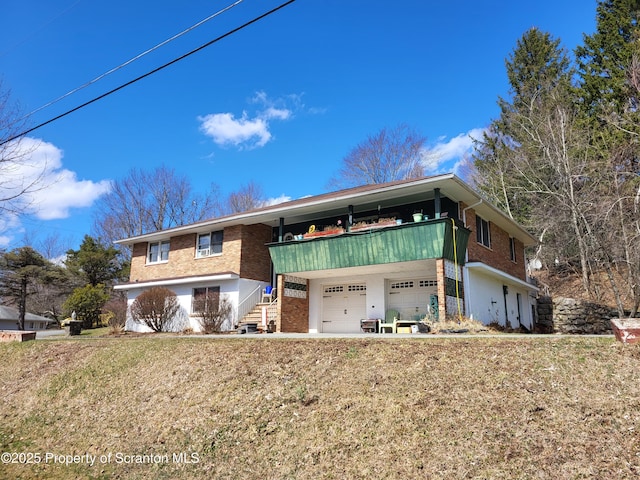 view of front of house with brick siding and an attached garage