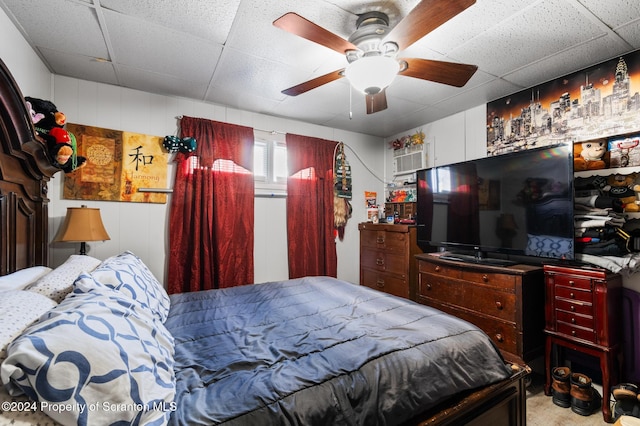 bedroom featuring a paneled ceiling and ceiling fan