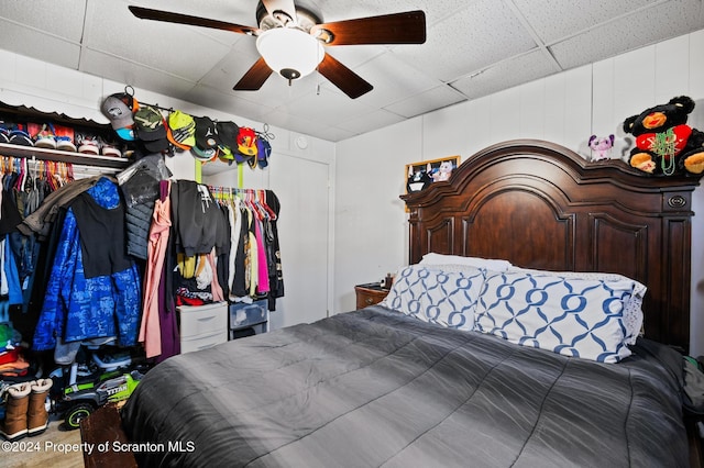 bedroom featuring a paneled ceiling and ceiling fan