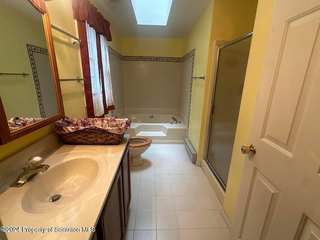 full bathroom featuring vanity, separate shower and tub, toilet, and a skylight