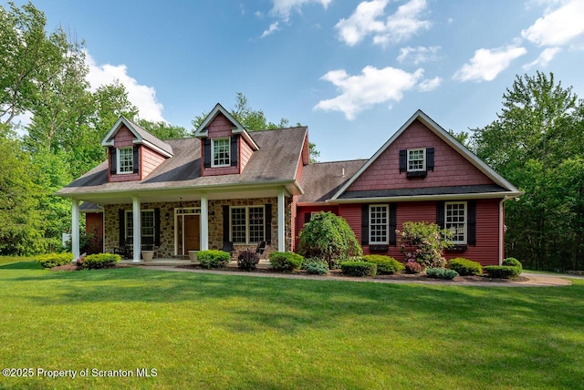 268 Winship Rd, Covington Twp, PA 18444 - cape cod-style house featuring a porch, a front lawn, and stone siding