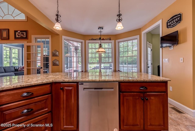 268 Winship Rd, Covington Twp, PA 18444 - kitchen with dishwasher, decorative light fixtures, light stone counters, light tile patterned floors, and open floor plan