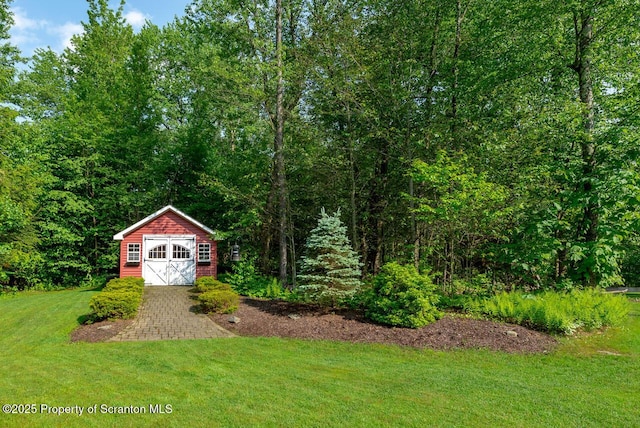268 Winship Rd, Covington Twp, PA 18444 - view of grassy yard featuring a view of trees and a storage unit