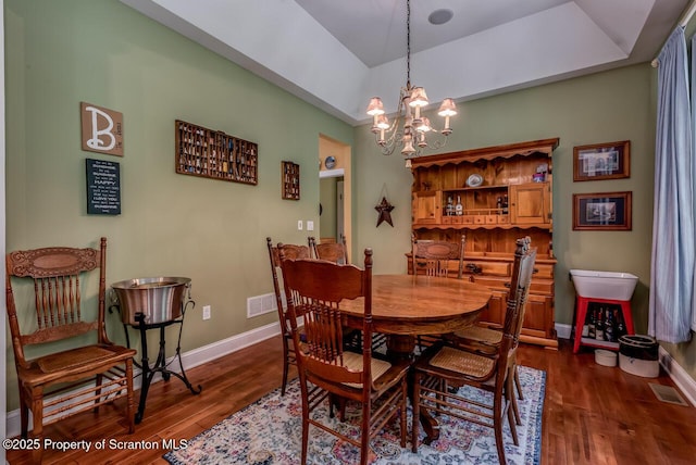268 Winship Rd, Covington Twp, PA 18444 - dining space with dark wood-style floors, a chandelier, and a raised ceiling