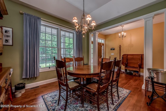 268 Winship Rd, Covington Twp, PA 18444 - dining area with decorative columns, hardwood / wood-style flooring, and a chandelier