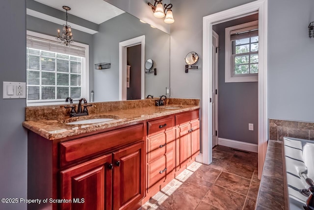 268 Winship Rd, Covington Twp, PA 18444 - bathroom featuring double vanity and a chandelier