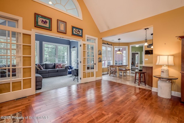 268 Winship Rd, Covington Twp, PA 18444 - living room with wood-type flooring, french doors, and high vaulted ceiling